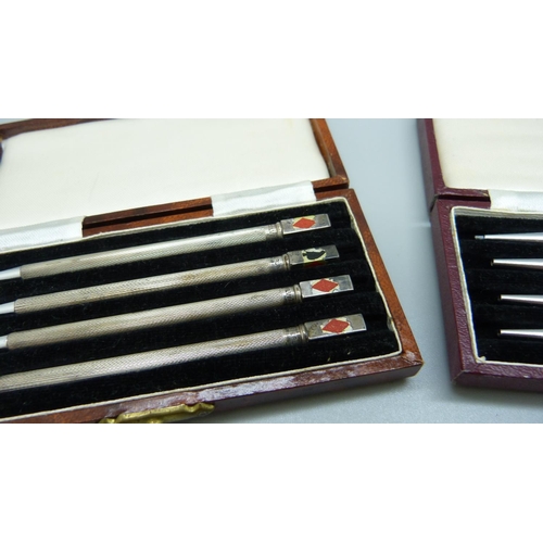 868 - Two sets of four silver whist pencils, cased