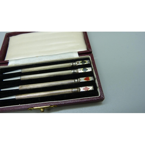 868 - Two sets of four silver whist pencils, cased