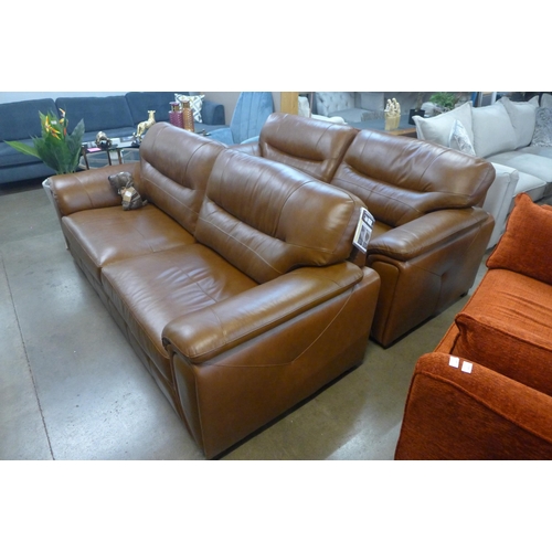 1301 - A pair of Regency tan leather three seater sofas