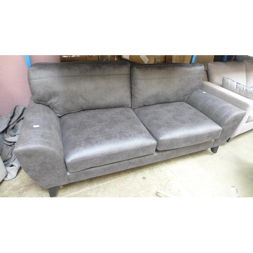 1325 - A graphite upholstered three seater sofa