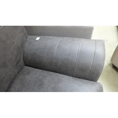 1325 - A graphite upholstered three seater sofa