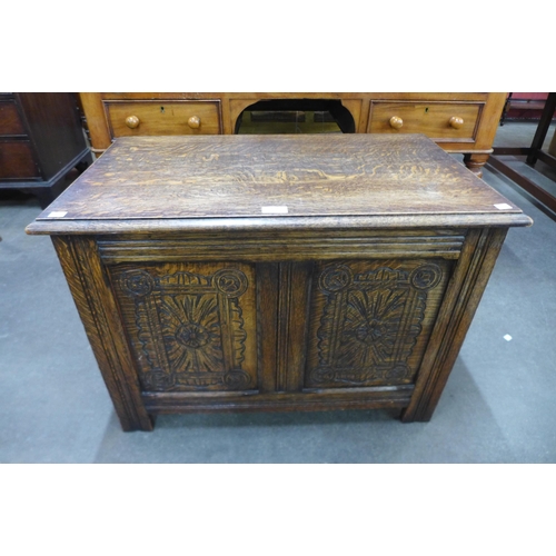 101 - A small 17th Century style carved oak coffer