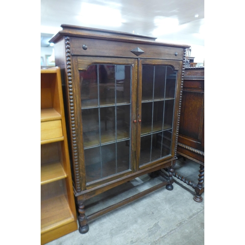 107 - An oak barleytwist two door bookcase