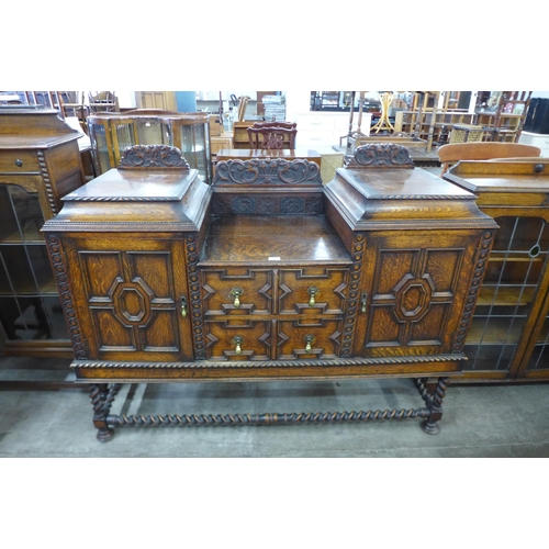 108 - A carved oak barleytwist sideboard