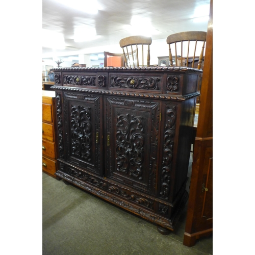 116 - A 19th Century Portuguese carved oak cupboard