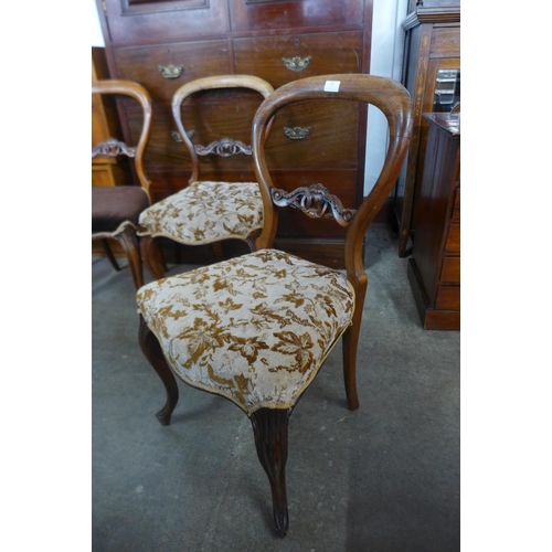 119 - A set of five Victorian rosewood balloon back dining chairs