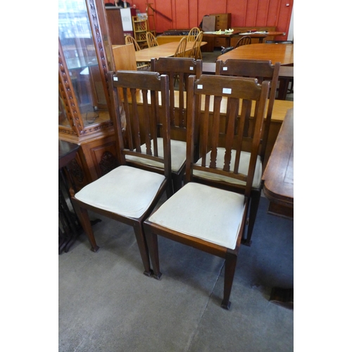 146 - A set of four Arts and Crafts beech dining chairs