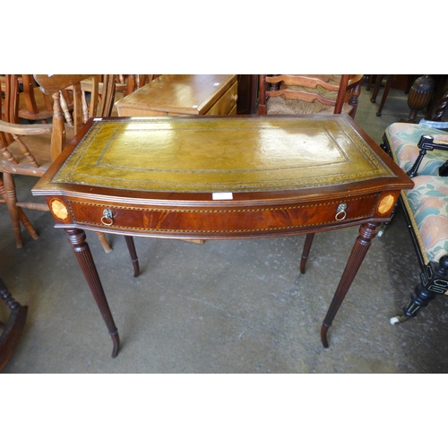 150 - A Regency style inlaid mahogany and green leather topped single drawer side table