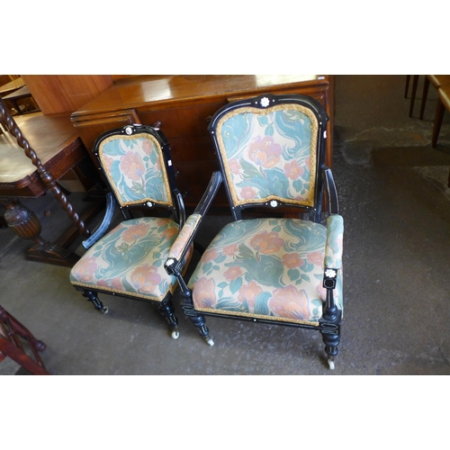 152 - A pair of Victorian Aesthetic Movement ebonised and fabric upholstered chairs