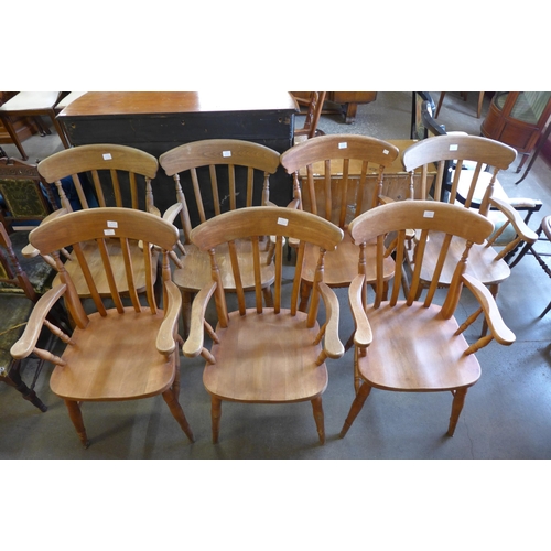 203 - A set of seven beech elbow chairs