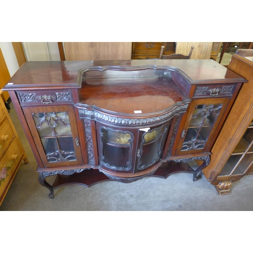 204 - An Edward VII carved mahogany side cabinet