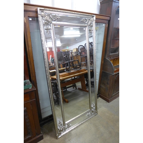 233 - A large French style silver effect framed mirror