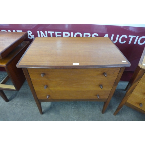 26 - A pair of teak chests of drawers