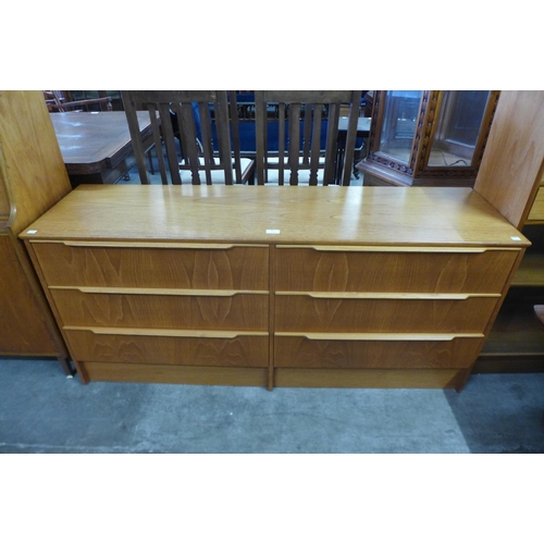 69 - A teak chest of drawers