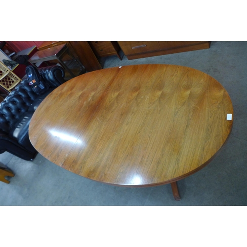 7 - An Archie Shine rosewood extending dining table, designed by Robert Heritage

*Accompanied by CITES ... 