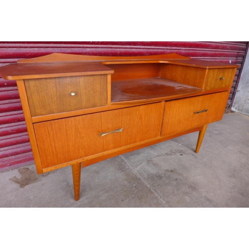 81a - A small teak sideboard