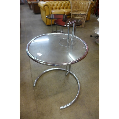 84 - An Eileen Gray style chrome and glass topped circular occasional table