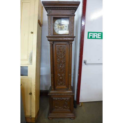 95 - A Black Forest carved oak 8-day longcase clock