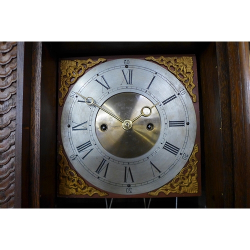 95 - A Black Forest carved oak 8-day longcase clock