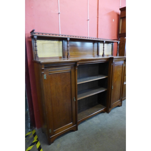 96 - A Victorian Aesthetic Movement walnut breakfront bookcase