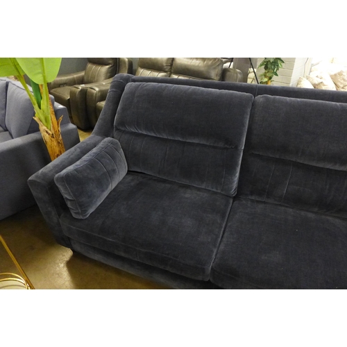 1431 - A midnight blue velvet, high back three seater sofa and footstool