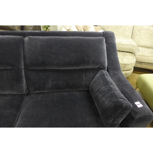 1431 - A midnight blue velvet, high back three seater sofa and footstool