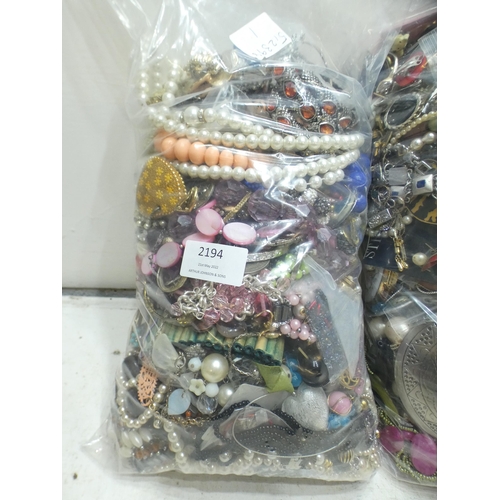 2194 - 2 Bags, approx. 5kg, of costume jewellery