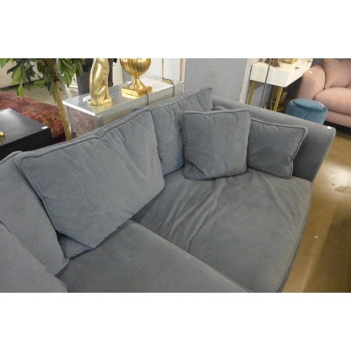 1305 - A steel blue velvet three seater sofa