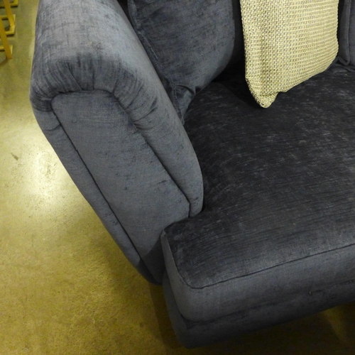 1375 - A large blue velvet corner sofa with reversible seat cushions