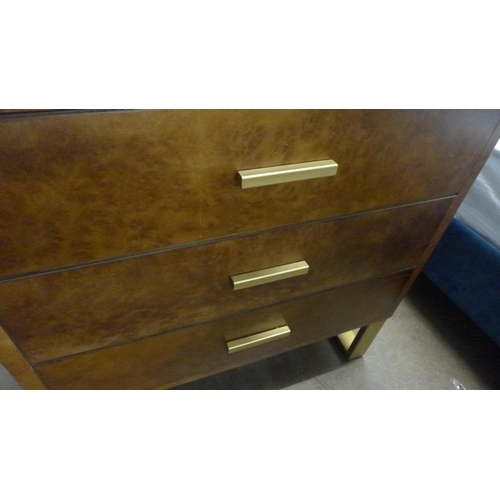 1413 - A walnut veneer three drawer chest