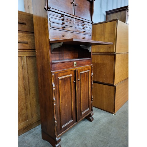 174 - A vintage stained softwood dentist cabinet