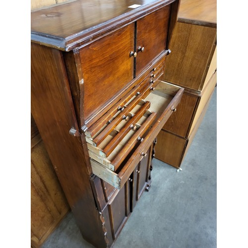 174 - A vintage stained softwood dentist cabinet