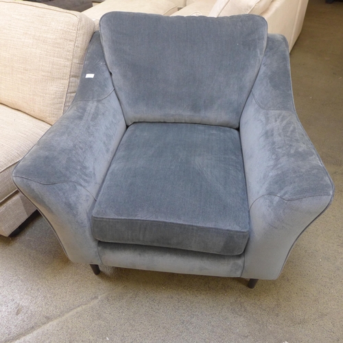 1993 - A blue upholstered armchair - damaged back rail