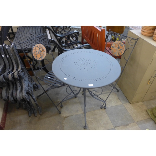 268 - An alloy garden table and two chairs