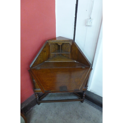 10 - An early 20th Century oak barleytwist corner bureau