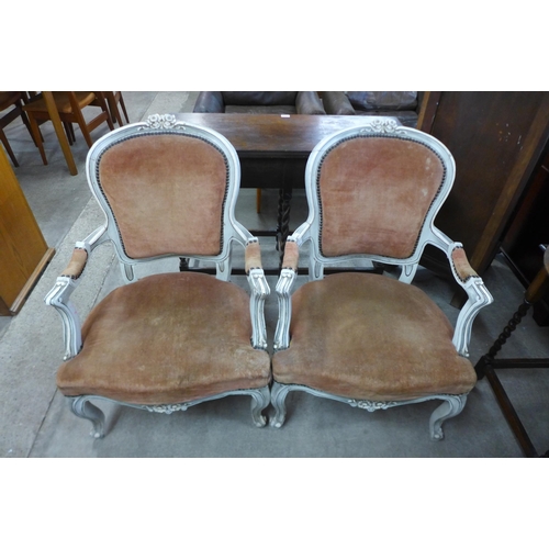 109 - A pair of French cream and fabric upholstered fauteuil armchairs