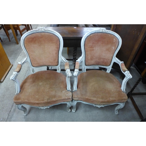 109 - A pair of French cream and fabric upholstered fauteuil armchairs