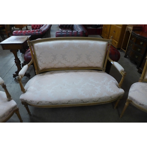 11 - A French style beech and fabric upholstered three piece salon suite