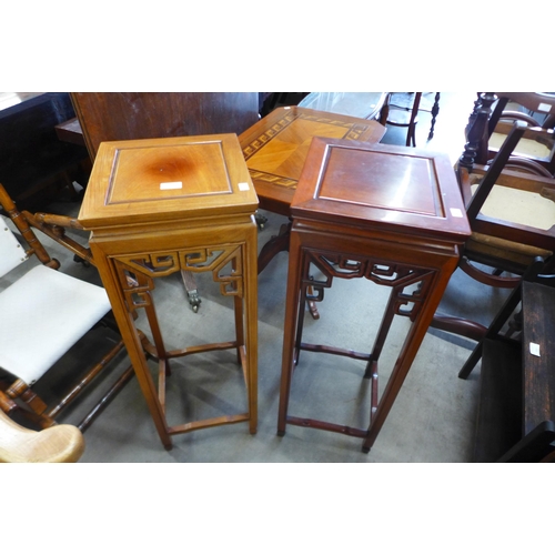 115 - A pair of Chinese hardwood jardiniere stands