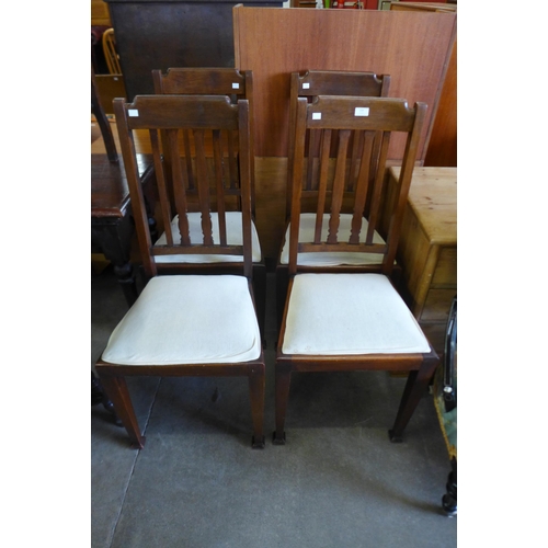 124 - A set of four Arts and Crafts beech dining chairs