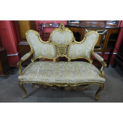 130 - A French Louis XV style giltwood canape settee