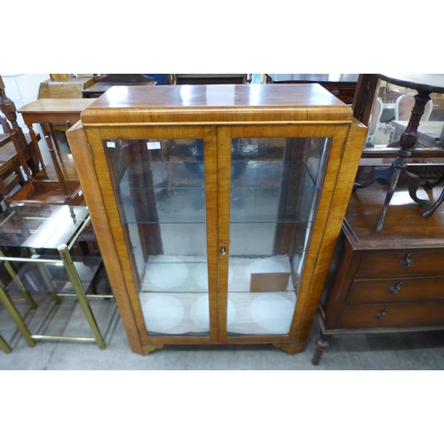 139 - A walnut display cabinet