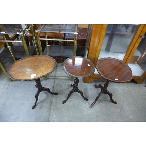 140 - Two mahogany tripod wine tables and a walnut wine table