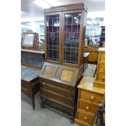 146 - An oak barleytwist bureau bookcase