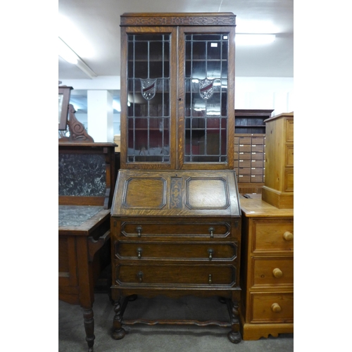 146 - An oak barleytwist bureau bookcase