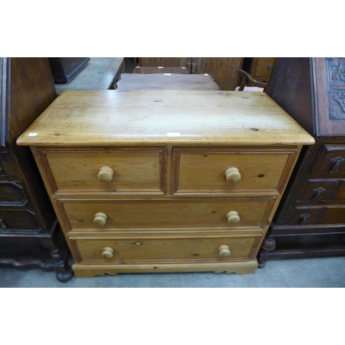 148 - A Victorian style waxed pine chest of drawers