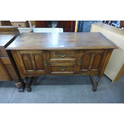 157 - A carved oak sideboard