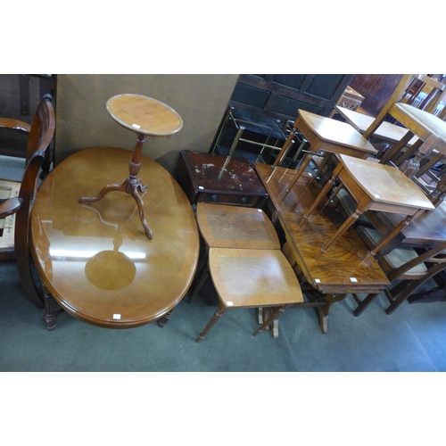 181 - A mahogany oval coffee table, a walnut nest of tables, a wine table and occasional tables (9)