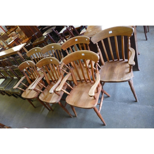 186 - A set of seven beech elbow chairs