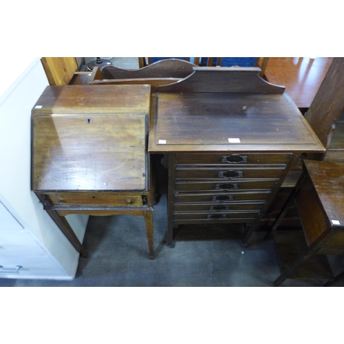 193 - An Edward VII mahogany music cabinet, an Edward VII inlaid mahogany bureau de dame and two others